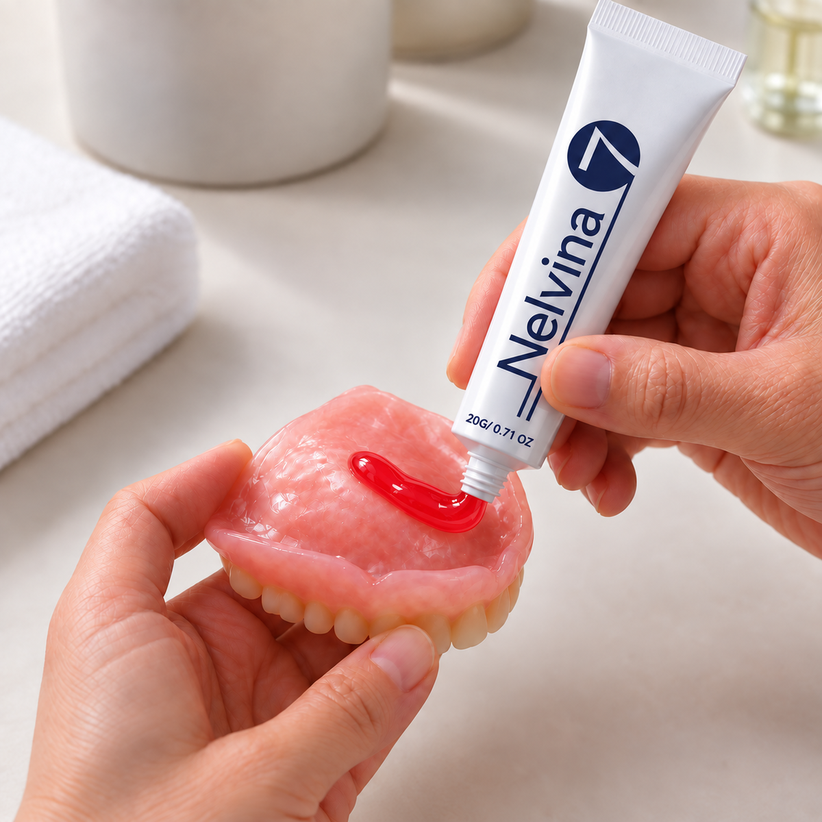 Applying Nelvina Denture Reliner to a clean denture